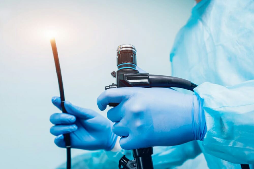 a surgeon holding a probe